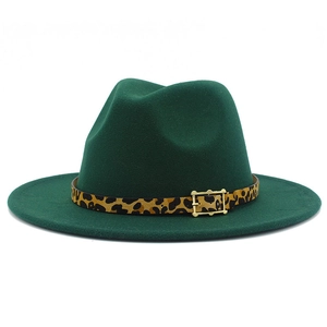 Detail of forest green wool fedora hat featuring leopard print belt and golden metal buckle