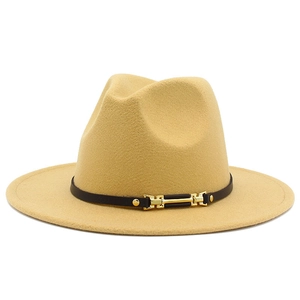 Detail of camel fedora hat featuring a black belt with gold metal chain and stud embellishments