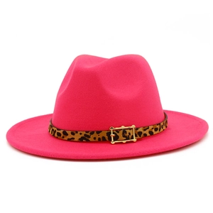 Detail of rose pink fedora hat featuring leopard print belt and golden buckle