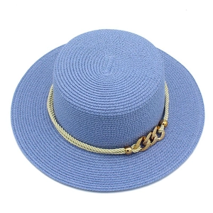 Detail of lavender flat top straw hat with beige rope and golden chain buckle