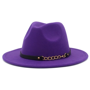 Detailed close-up of purple fedora hat featuring black leather band and gold metal chain