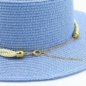 Detail of blue straw hat weave with gold metal chain and lobster clasp adjustment