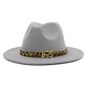 Detail shot of the gray fedora hat featuring a leopard print band and gold buckle accent