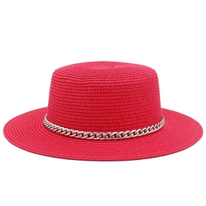Red straw boater sun hat for women featuring a stylish silver chain and wide flat brim