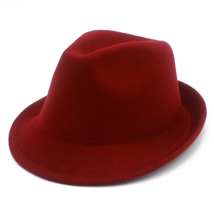 Detail view of burgundy faux wool jazz fedora hat with classic indented top design