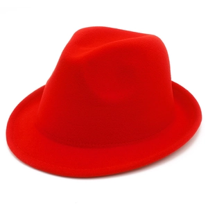 Detailed view of thick red wool fedora hat with classic indented crown and rolled brim edge