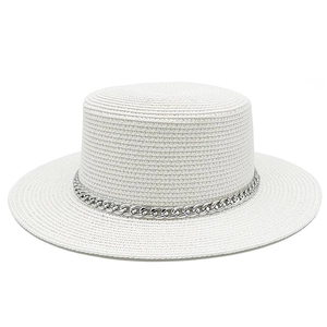 Detail of white boater hat with fine woven texture and silver metal chain decoration