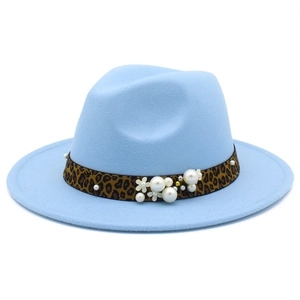 Detailed view of light blue fedora hat with leopard print band and pearl floral accents