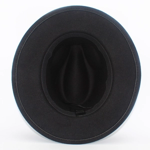Detail of black fedora hat interior showing the 65% polyester and 35% cotton fabric label