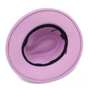 Detail shot of the pink fedora hat interior with 65% cotton blend fabric material label