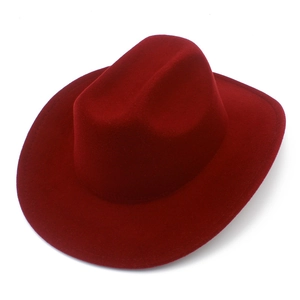 Detailed macro view of the burgundy felt texture and stitching on the western cowboy hat