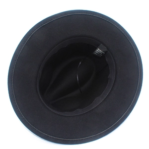 Detail shot of the black fedora hat interior showing the 65% cotton blend fabric label