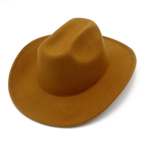 Close-up of a classic camel felt western cowboy hat with a wide brim and detailed stitching