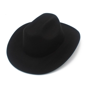 Detail view of a classic black wide-brim cowboy hat with matte wool felt texture
