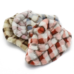 Detail showing thick faux rabbit fur texture on checkered plaid bucket hats for winter