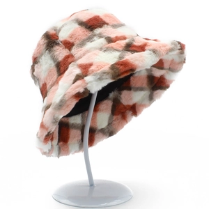 Detailed view of the soft faux fur texture and plaid pattern on the winter bucket hat