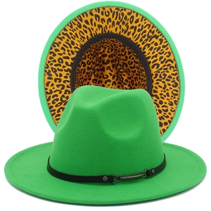 Detail of green wide brim fedora hat featuring yellow leopard print lining and leather band