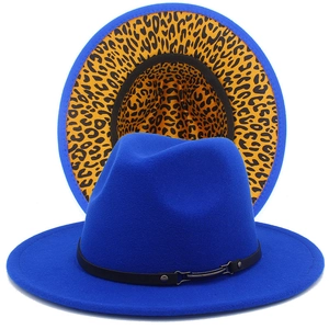 Detail of bright blue fedora hat with leopard print brim and black leather buckle belt