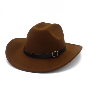 Close-up of brown wool felt Fedora hat with black leather strap and silver metal buckle