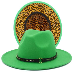 Detail view of green fedora hat featuring leopard print lining and a black studded belt