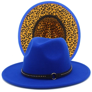 Detail of royal blue fedora hat featuring yellow leopard print on the inner brim