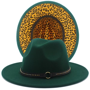 Close-up of green wool fedora with leopard print lining and studded metal buckle belt
