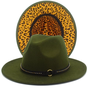 Detail of olive green fedora with studded leather band and leopard print brim underside