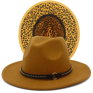 Detail of camel fedora hat featuring leopard print lining and studded black band decoration