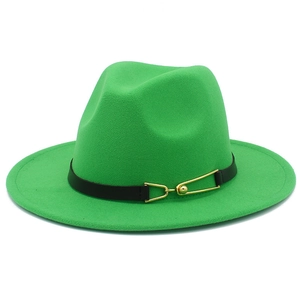 Detail of green fedora hat featuring black leather band and golden metal buckle accessory