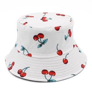 Reversible cotton bucket hat with cute cherry print for women sun protection on white background