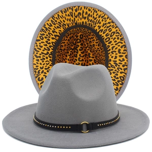 Detail of grey fedora hat with metal stud band and stylish leopard print lining