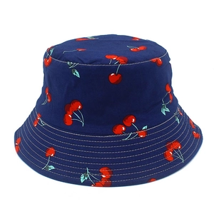 Reversible cotton bucket hat with cute cherry print in navy blue for sun protection