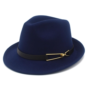 Detailed close-up of dark blue wool fedora hat with black leather band and gold buckle