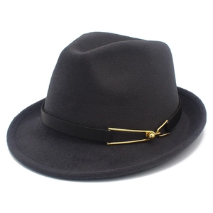 Detail of dark grey fedora hat with fine wool texture and gold buckle leather band
