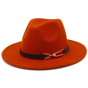 Close-up of orange wool fedora hat with black leather belt and gold metal buckle detail