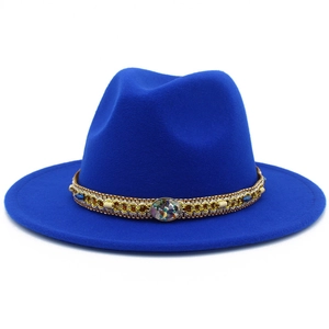 Detailed close-up of blue wool jazz hat featuring a boho decorative bead and gold chain band