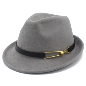 Detail of grey wool fedora hat featuring black leather band and golden geometric buckle