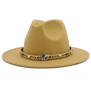 Detail of wool fedora hat with ethnic turquoise beads and colorful tassel band