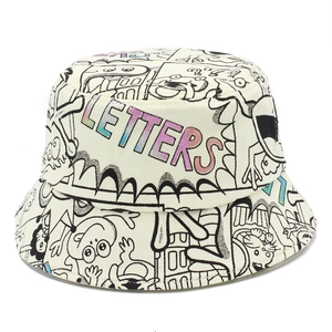 Detail of cotton bucket hat featuring black line doodle art and colorful letters embroidery
