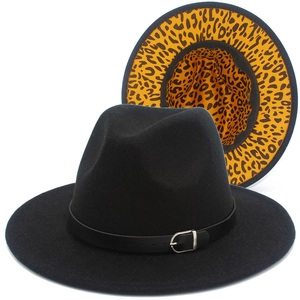 Detail view of black wool fedora featuring leopard print lining and leather belt buckle