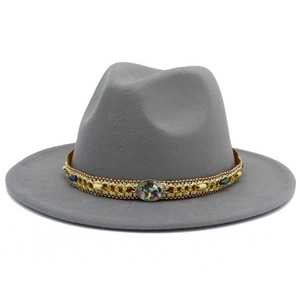 Detail of grey wool felt fedora with ethnic beaded band and gold chain decoration