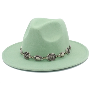 Detailed view of mint green felt jazz hat featuring a vintage silver metal buckle chain