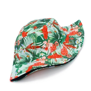 Tropical bucket hat featuring pink flamingos and hibiscus flowers on mint green fabric