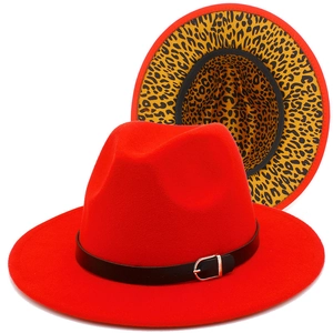 Red wool fedora hat with leopard print lining and black leather belt with silver buckle