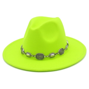 Detail of neon green wool fedora hat featuring an ornate silver metal chain band trim