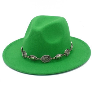 Detailed view of green wool fedora hat featuring a vintage silver metal chain band