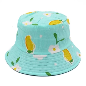 Reversible cotton bucket hat with mango and flower print on mint green fabric