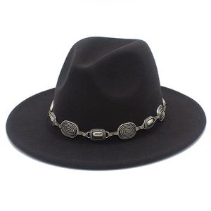 Detail of vintage metal chain buckle on black wool felt western fedora hat