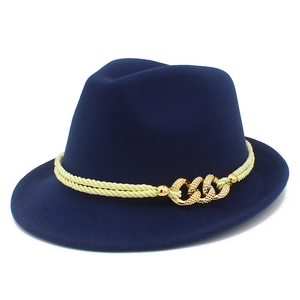 Detailed close-up of a navy blue wool fedora with a braided rope and gold metal chain