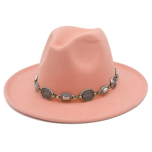 Detail of western cowboy wool fedora hat with vintage silver metal chain buckle decoration